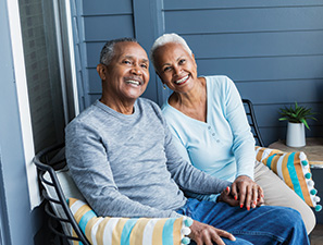 A couple sitting on a porch. Links to Beneficiary Designations A couple sitting on a porch. Links to Beneficiary Designations